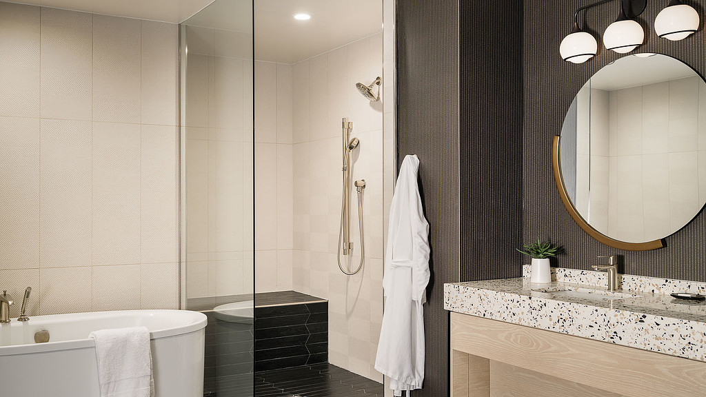 A bathroom with a tub and sink.